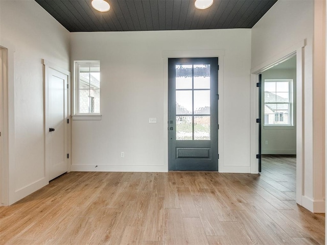 1203 Jaden Blvd, Tuttle, OK 73089 - foyer entrance with light wood finished floors, healthy amount of natural light, wooden ceiling, and baseboards
