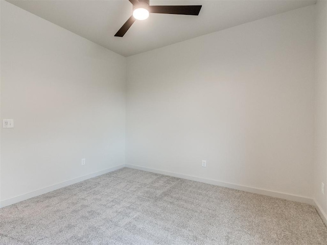 1203 Jaden Blvd, Tuttle, OK 73089 - spare room featuring light carpet, a ceiling fan, and baseboards