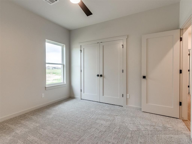 1203 Jaden Blvd, Tuttle, OK 73089 - unfurnished bedroom featuring carpet floors, baseboards, a closet, and a ceiling fan