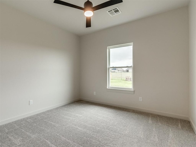 1203 Jaden Blvd, Tuttle, OK 73089 - empty room featuring light carpet, baseboards, and a ceiling fan