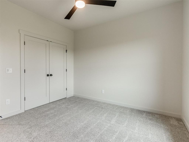 1203 Jaden Blvd, Tuttle, OK 73089 - unfurnished bedroom featuring carpet, baseboards, a ceiling fan, and a closet