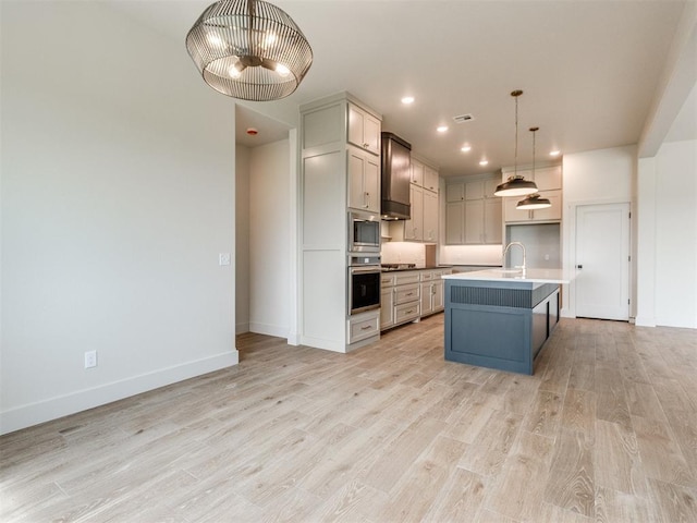 1203 Jaden Blvd, Tuttle, OK 73089 - kitchen featuring stainless steel appliances, light wood-type flooring, baseboards, recessed lighting, and pendant lighting