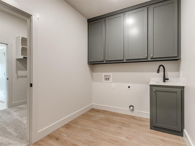 1203 Jaden Blvd, Tuttle, OK 73089 - washroom featuring electric dryer hookup, cabinet space, hookup for a washing machine, and baseboards
