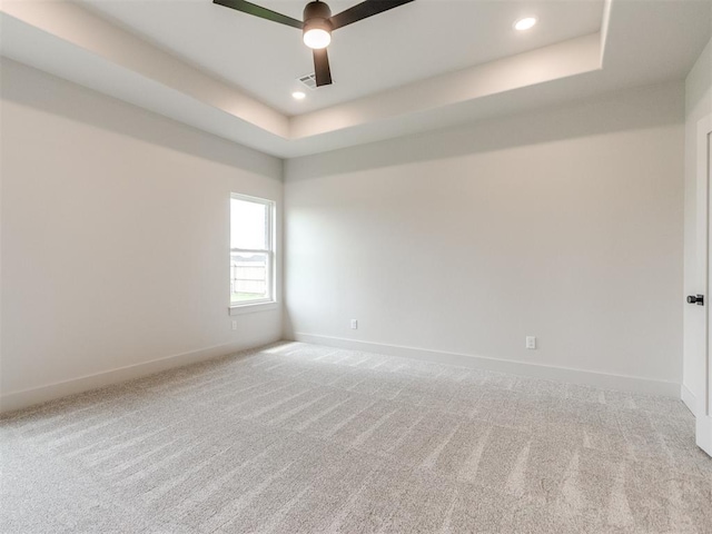 1203 Jaden Blvd, Tuttle, OK 73089 - empty room with a ceiling fan, carpet floors, baseboards, a tray ceiling, and recessed lighting