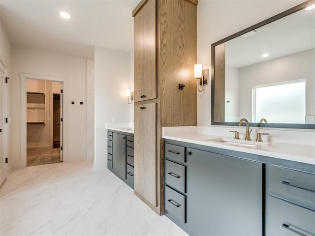 1203 Jaden Blvd, Tuttle, OK 73089 - full bath featuring vanity, marble look tile flooring, a walk in closet, and recessed lighting