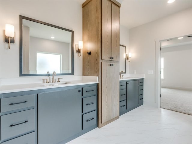 1203 Jaden Blvd, Tuttle, OK 73089 - bathroom featuring vanity, marble look tile flooring, and recessed lighting