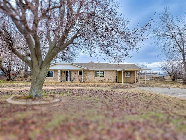 ranch-style home with a carport