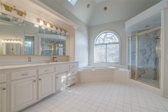 bathroom with tile patterned floors, vanity, separate shower and tub, and lofted ceiling