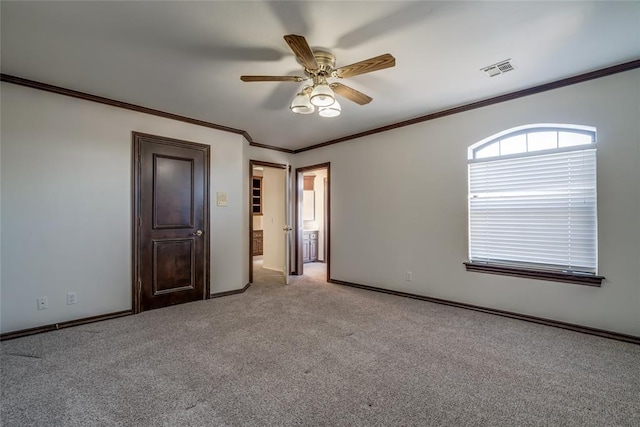 unfurnished bedroom with ceiling fan, light colored carpet, and ornamental molding