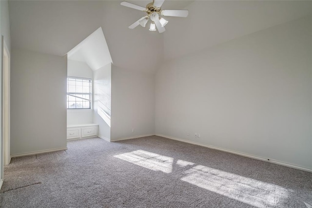 bonus room with light colored carpet, vaulted ceiling, and ceiling fan