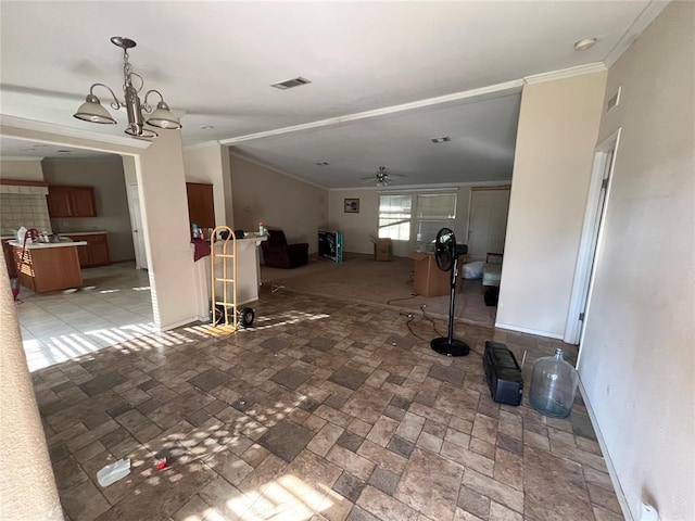 living room featuring ceiling fan with notable chandelier and ornamental molding