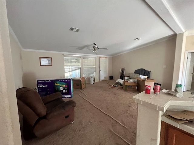 carpeted living room featuring ceiling fan and ornamental molding