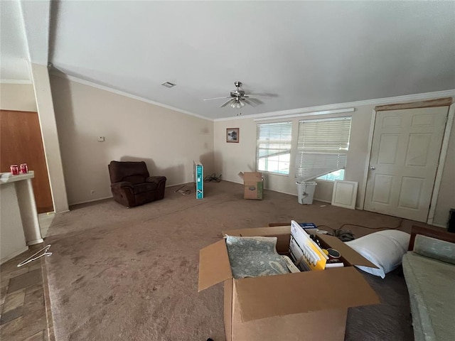 carpeted living room featuring crown molding and ceiling fan