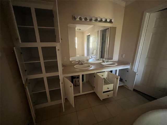 bathroom featuring tile patterned floors and sink