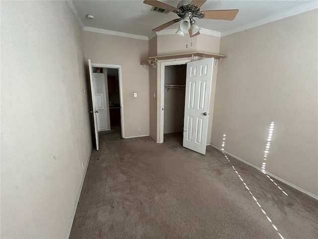 unfurnished bedroom with ceiling fan, a closet, carpet floors, and ornamental molding