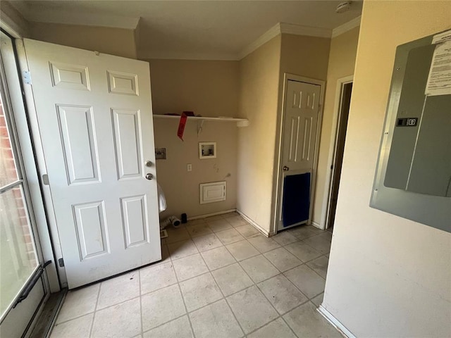 laundry room with hookup for a washing machine, electric panel, crown molding, and light tile patterned flooring