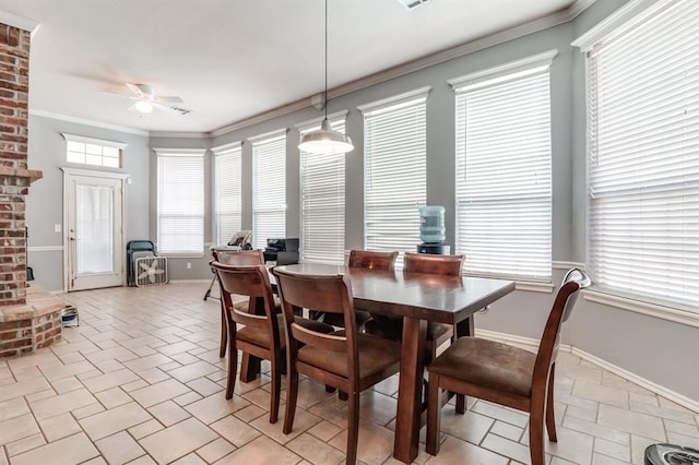 dining area featuring ceiling fan, crown molding, and light tile patterned floors