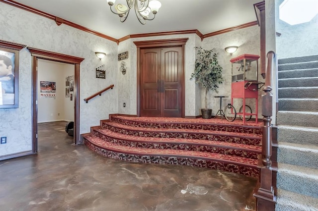 foyer with a chandelier and crown molding