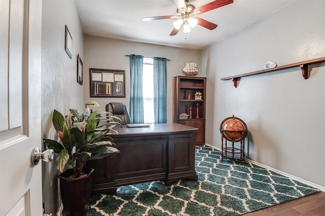 office area featuring ceiling fan and dark wood-type flooring