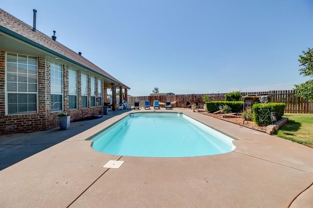 view of swimming pool featuring a patio area