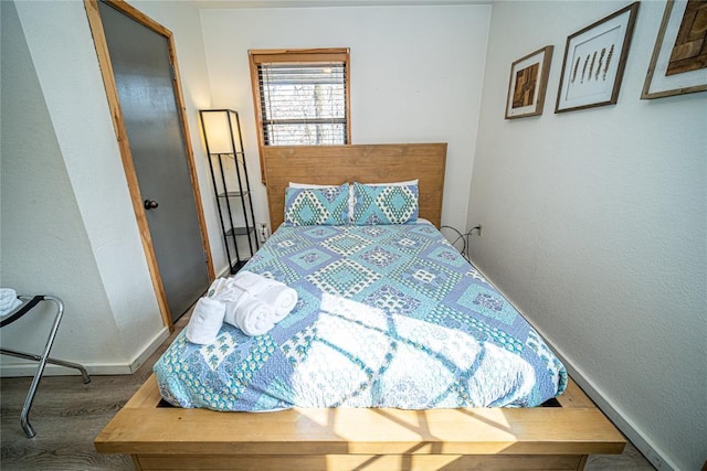 bedroom featuring hardwood / wood-style flooring