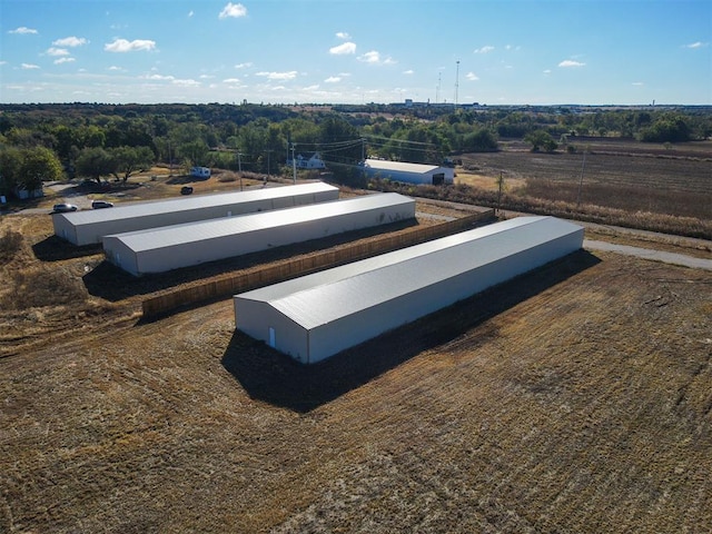 birds eye view of property featuring a rural view