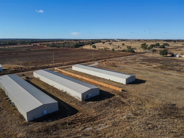 birds eye view of property with a rural view