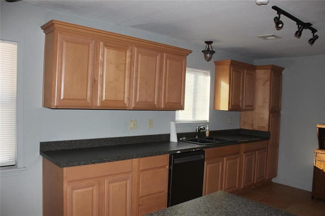 kitchen with dishwasher, dark tile patterned flooring, and sink