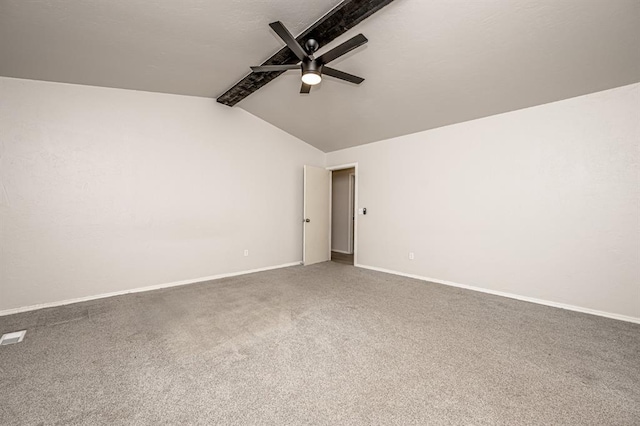 carpeted empty room with lofted ceiling with beams and ceiling fan