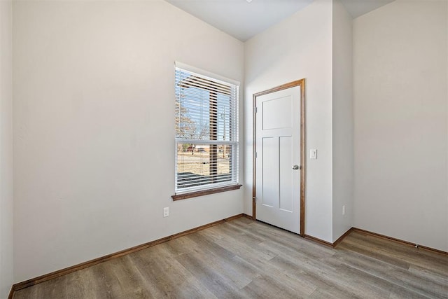 spare room featuring light wood-type flooring