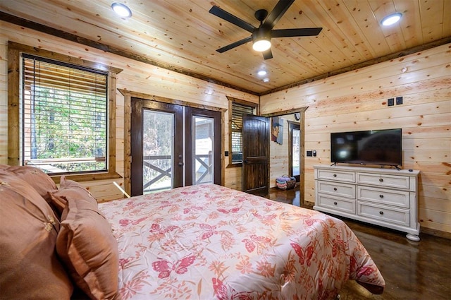 bedroom with access to exterior, ceiling fan, french doors, wood walls, and wood ceiling