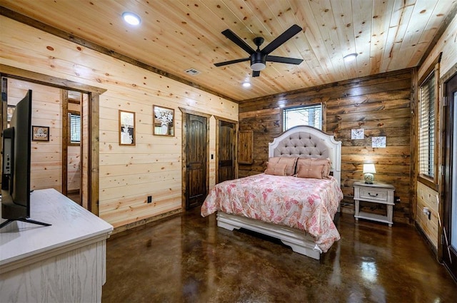 bedroom with ceiling fan, wooden ceiling, and wood walls