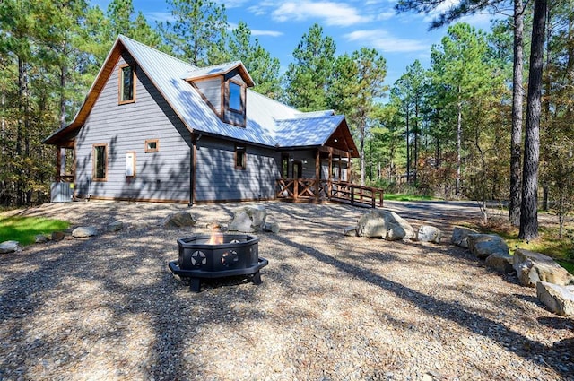 exterior space with a fire pit