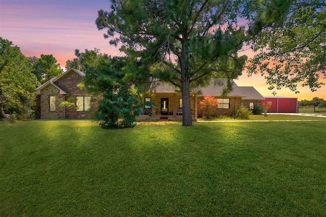 view of front of house with a yard