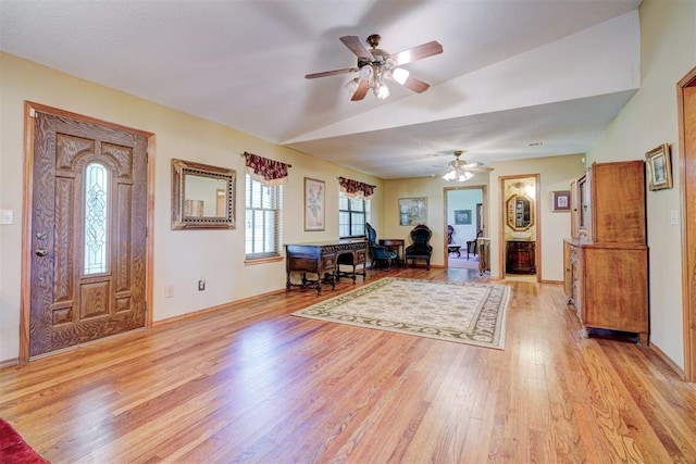 entryway featuring ceiling fan, light hardwood / wood-style flooring, and vaulted ceiling