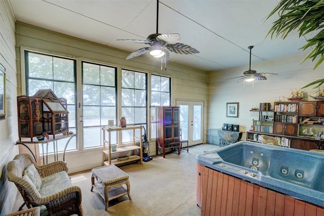 interior space with a jacuzzi and french doors