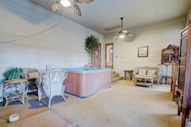 view of patio with a hot tub and ceiling fan