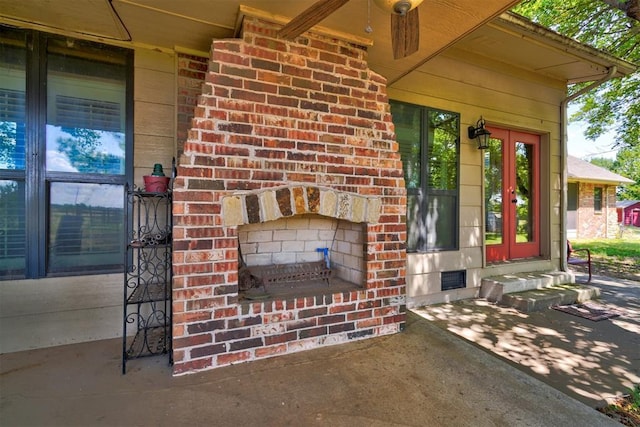 doorway to property featuring an outdoor brick fireplace