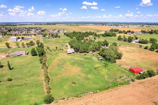 birds eye view of property featuring a rural view