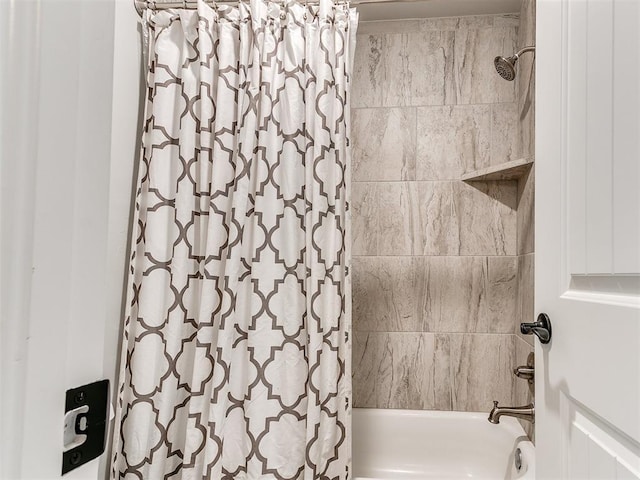 bathroom with shower / bathtub combination with curtain