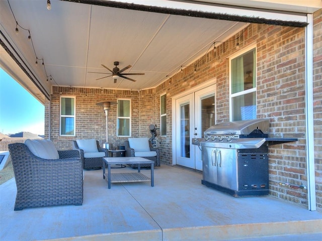 view of patio / terrace with grilling area and ceiling fan