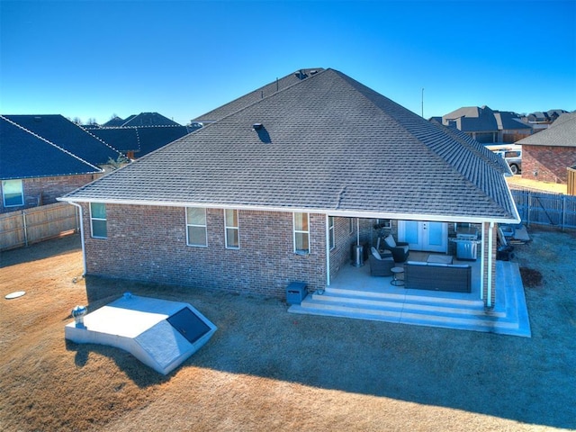 rear view of property with an outdoor hangout area and a patio