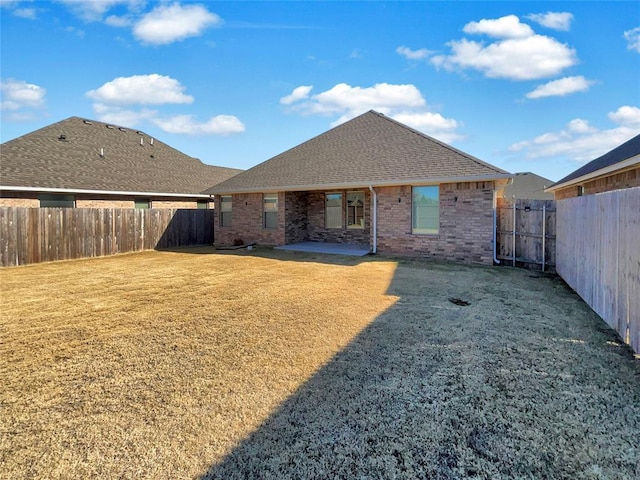 back of house with a patio