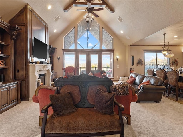 living room featuring ceiling fan with notable chandelier, high vaulted ceiling, light colored carpet, a textured ceiling, and french doors