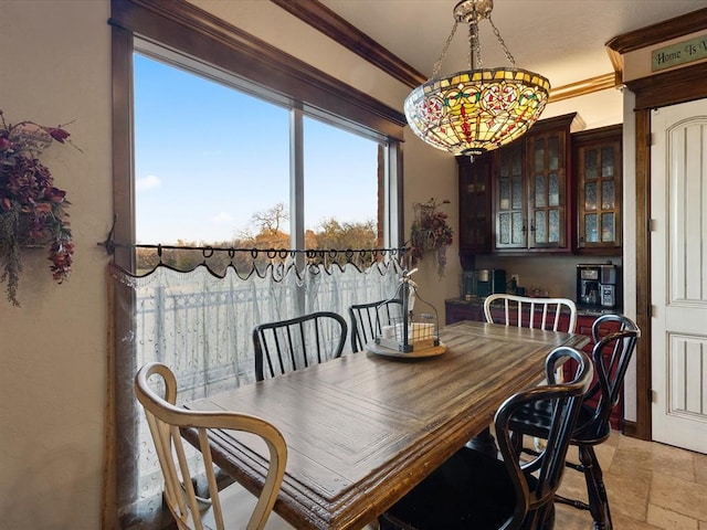 dining room featuring ornamental molding