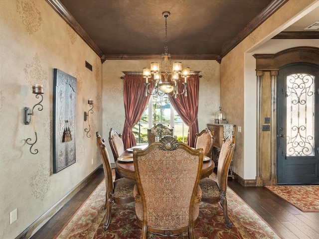 dining room with crown molding, dark wood-type flooring, and a notable chandelier