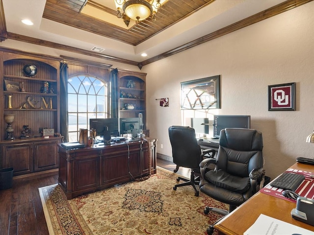 home office featuring dark wood-type flooring, crown molding, a raised ceiling, and wooden ceiling