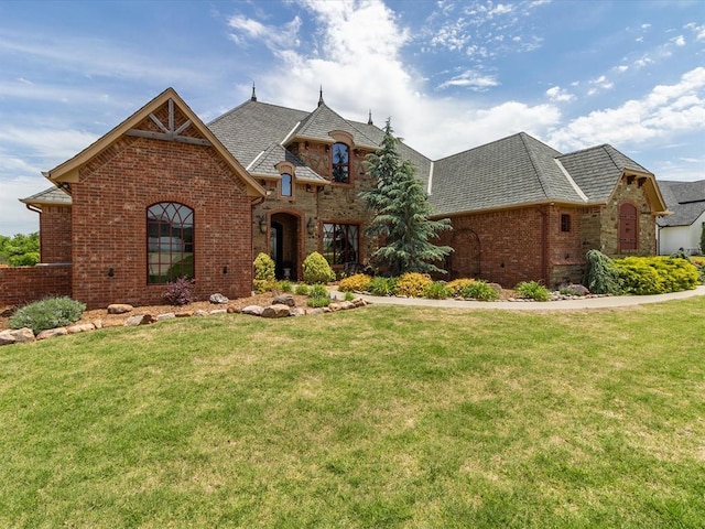 5451 Cottonwood Creek Cir, Norman, OK 73069 - french provincial home featuring brick siding and a front yard