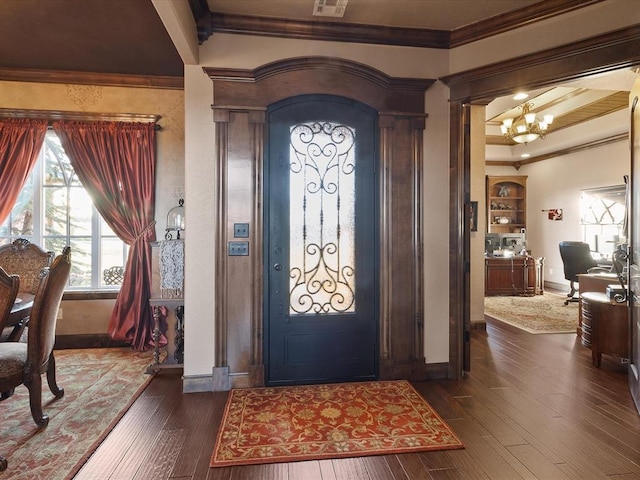 5451 Cottonwood Creek Cir, Norman, OK 73069 - foyer featuring crown molding, a chandelier, baseboards, and dark wood-style floors