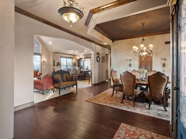 5451 Cottonwood Creek Cir, Norman, OK 73069 - dining space featuring arched walkways, a chandelier, crown molding, hardwood / wood-style flooring, and baseboards